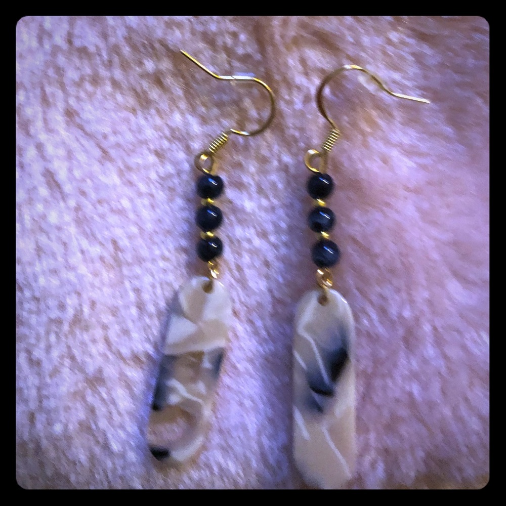 Earrings hand made black, cream, and clear resin